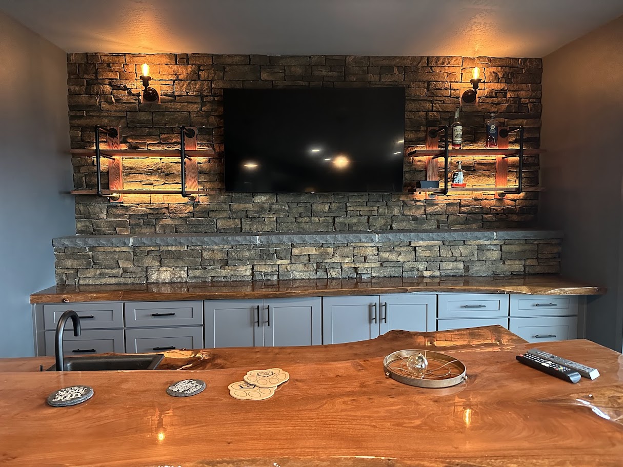 Custom basement wet bar with wood countertop and tile backsplash