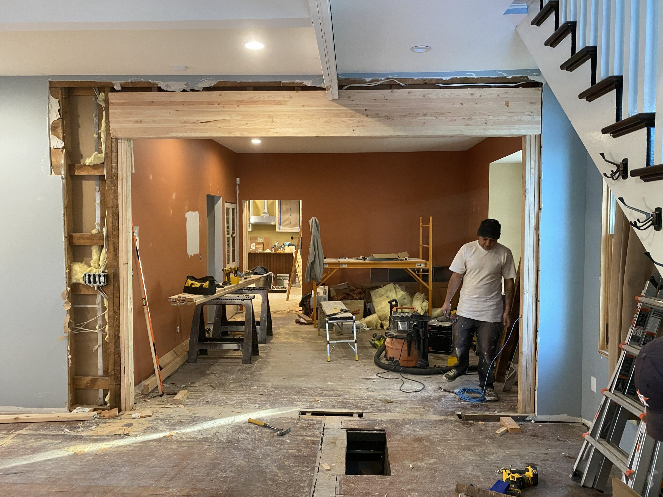 Load-bearing wall removal in progress - temporary support and new beam