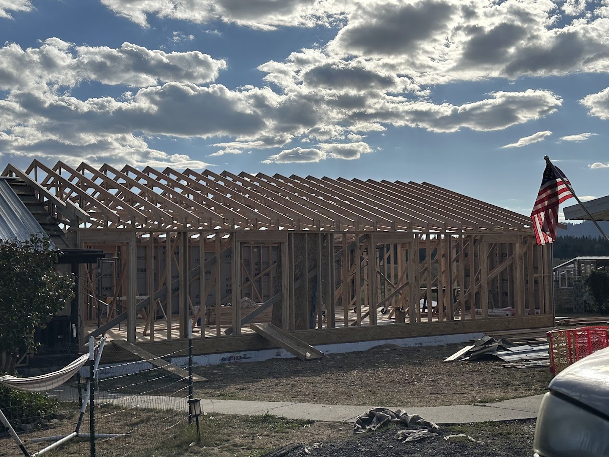 Travis Smith framing a structural wall - owner-led construction