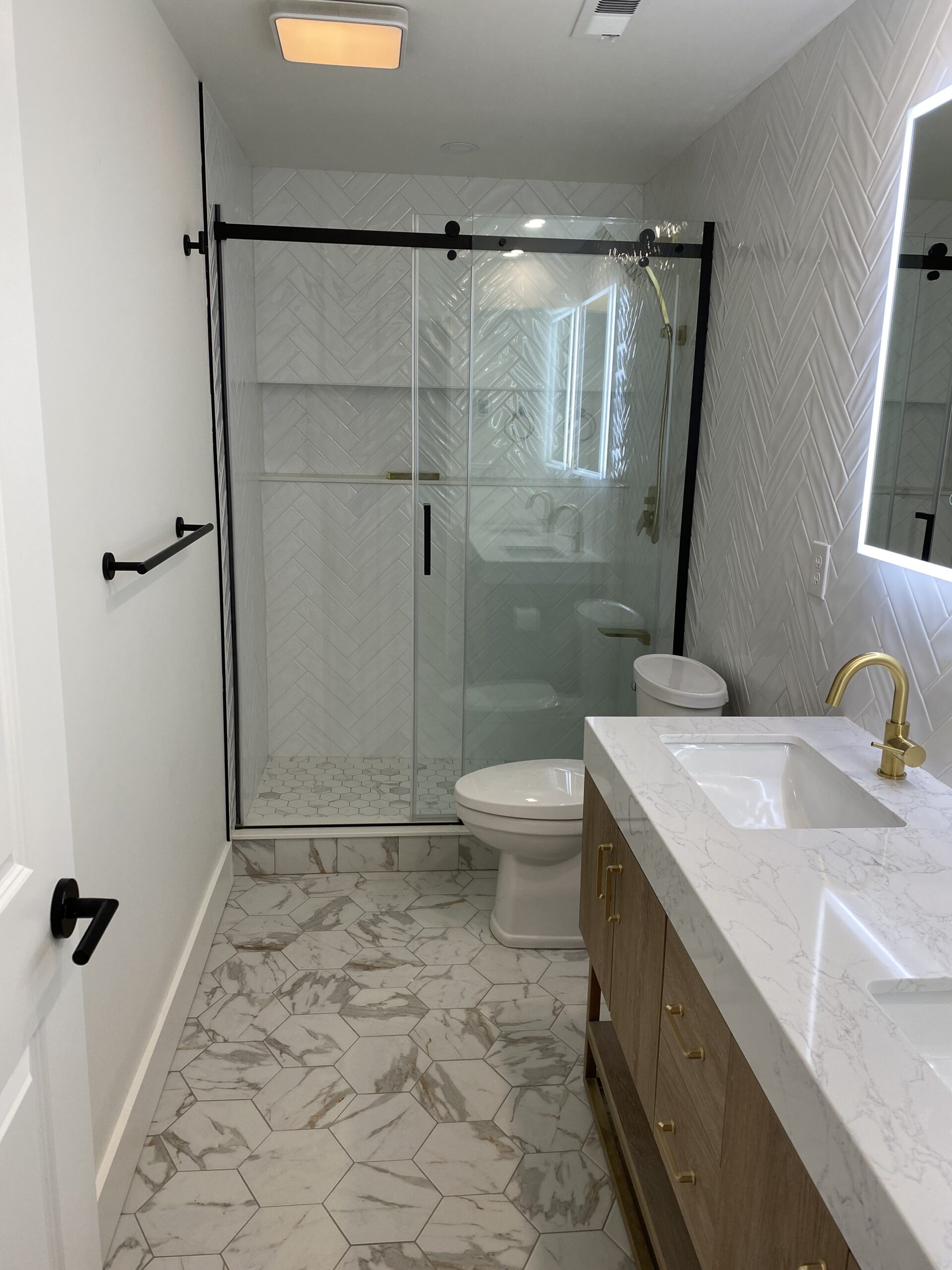 Master Bathroom Remodel with herringbone tile — Spokane Valley